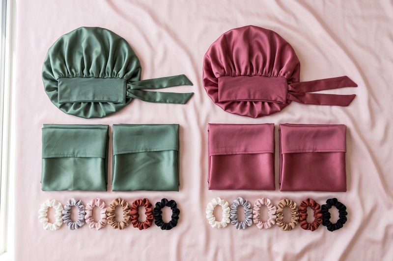 The Waves + Curls kit and the Curls + Coils kit laid out side by side.
